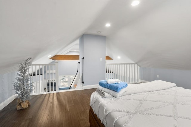 bedroom featuring hardwood / wood-style floors and lofted ceiling