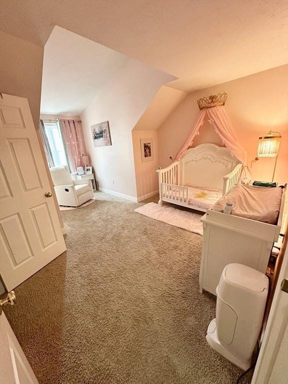 carpeted bedroom featuring baseboards and vaulted ceiling