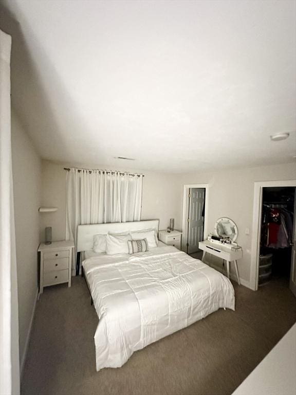 bedroom with baseboards, lofted ceiling, and carpet flooring