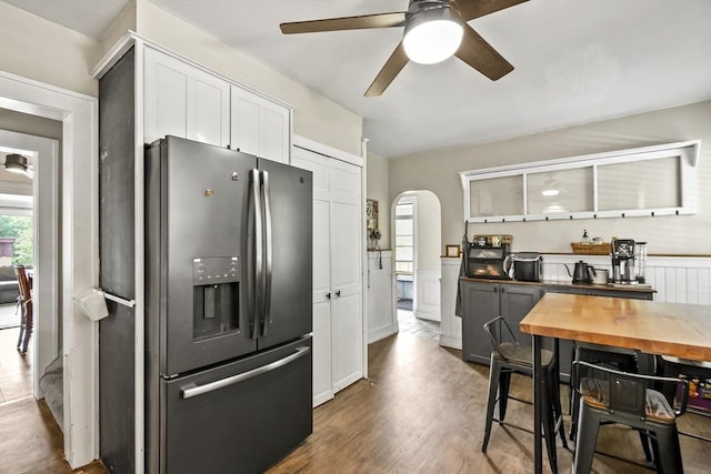 12 Boison St, Pittsfield, MA 01201 - kitchen featuring stainless steel fridge with ice dispenser, a ceiling fan, healthy amount of natural light, arched walkways, and a wainscoted wall