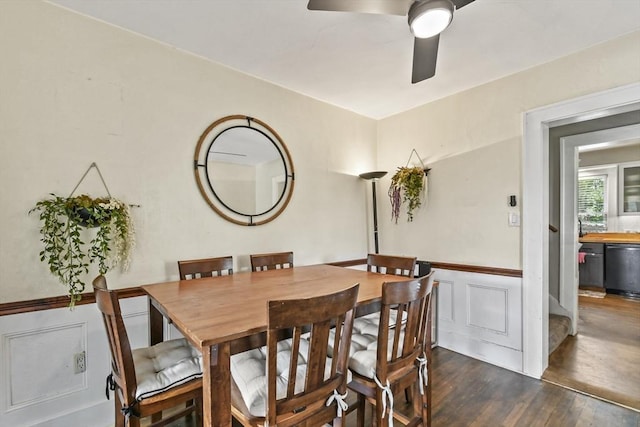 12 Boison St, Pittsfield, MA 01201 - dining room featuring a wainscoted wall, dark wood-style flooring, ceiling fan, and a decorative wall