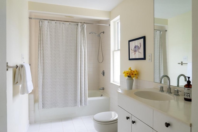bathroom featuring plenty of natural light, shower / bath combination with curtain, toilet, and vanity
