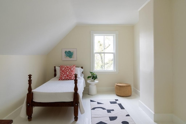 bedroom featuring lofted ceiling