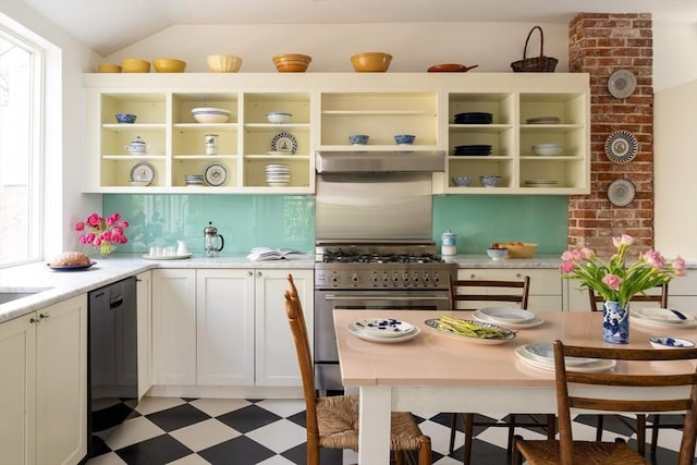 kitchen featuring open shelves, dishwasher, light floors, under cabinet range hood, and stainless steel range