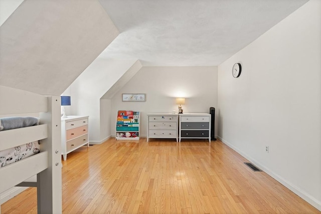 9 Michael Way Unit 41, Andover, MA 01810 - bedroom featuring light wood-style flooring, baseboards, and vaulted ceiling