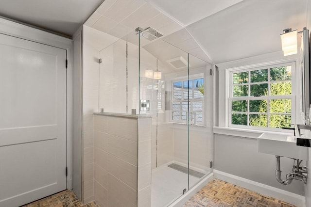 full bath with a stall shower and baseboards