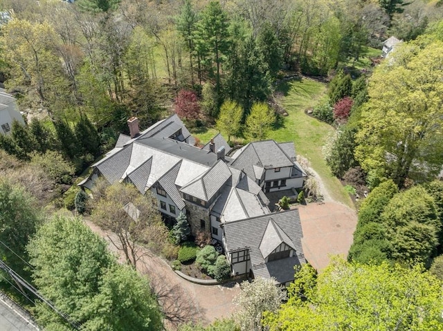 view of subject property featuring a forest