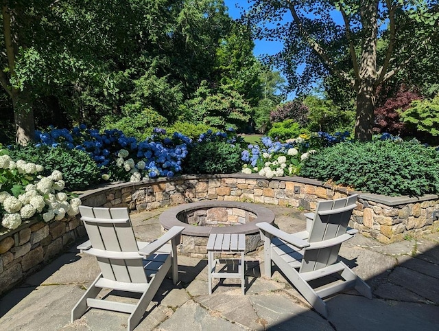 view of patio / terrace with a fire pit