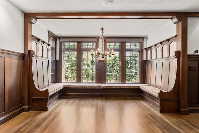 unfurnished sunroom featuring french doors and a chandelier