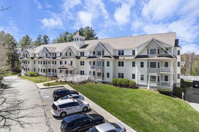 view of property featuring uncovered parking