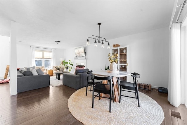 dining area featuring dark hardwood / wood-style flooring