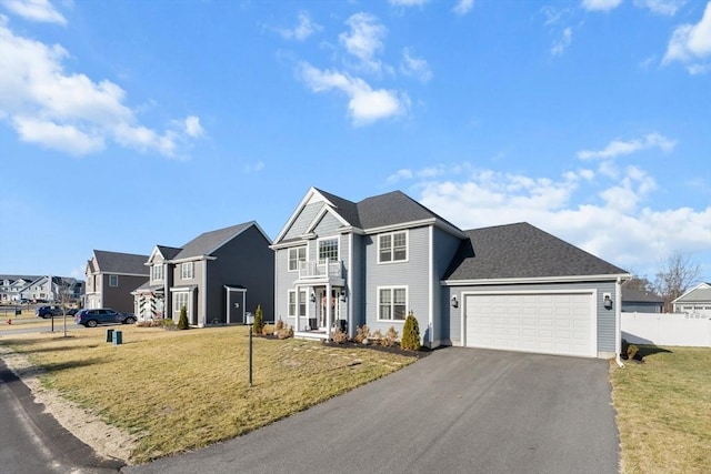 front of property with a garage and a front yard