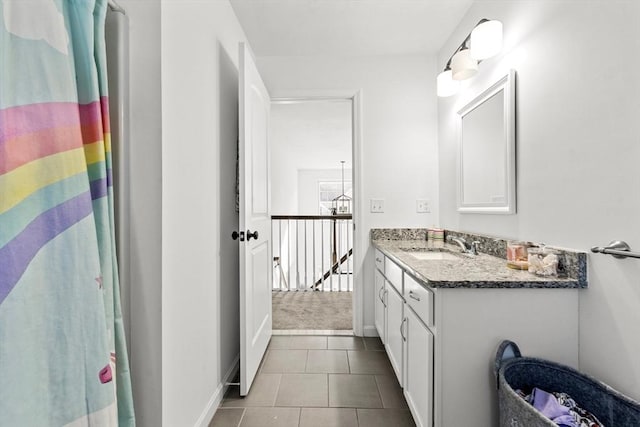 bathroom featuring tile patterned flooring, vanity, and a shower with shower curtain