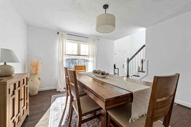 dining space with dark wood-type flooring