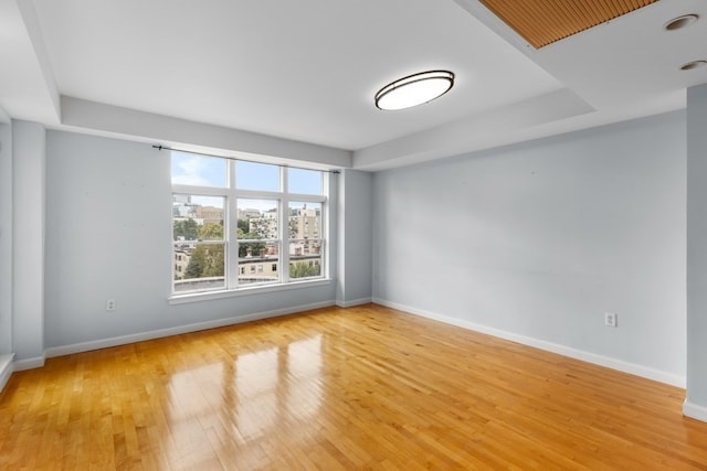 spare room with light hardwood / wood-style flooring