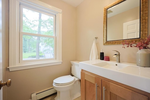 5 Taintor Dr, Sudbury, MA 01776 - half bathroom featuring baseboard heating, toilet, healthy amount of natural light, and vanity