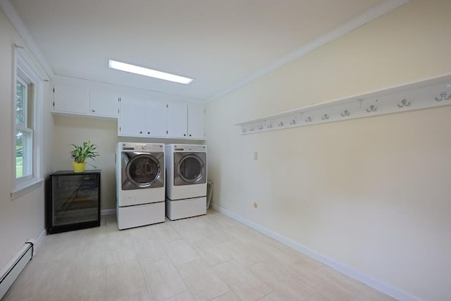 5 Taintor Dr, Sudbury, MA 01776 - laundry area featuring a baseboard heating unit, washer and dryer, cabinet space, ornamental molding, and baseboards