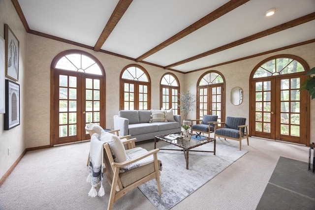 5 Taintor Dr, Sudbury, MA 01776 - carpeted living room with french doors, healthy amount of natural light, beam ceiling, baseboards, and ornamental molding