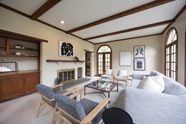 5 Taintor Dr, Sudbury, MA 01776 - living area with beam ceiling, french doors, a fireplace, light colored carpet, and crown molding