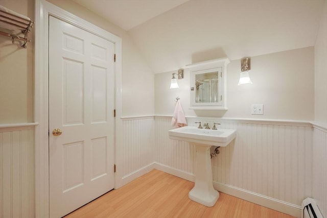 5 Taintor Dr, Sudbury, MA 01776 - bathroom with baseboard heating, wood finished floors, a wainscoted wall, and lofted ceiling