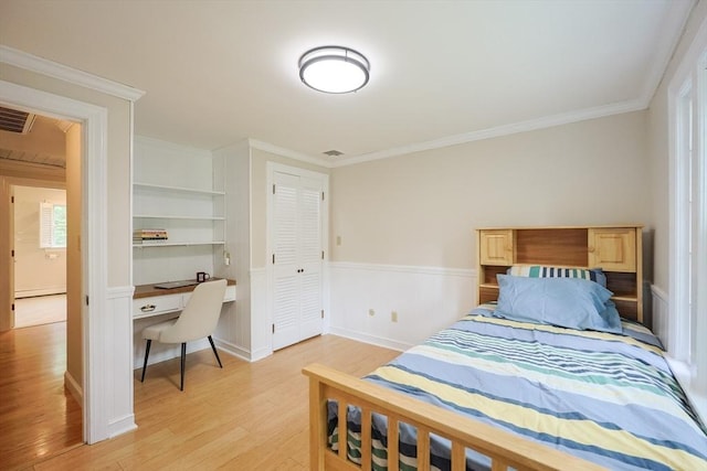 5 Taintor Dr, Sudbury, MA 01776 - bedroom with light wood-style floors, a wainscoted wall, ornamental molding, and a closet
