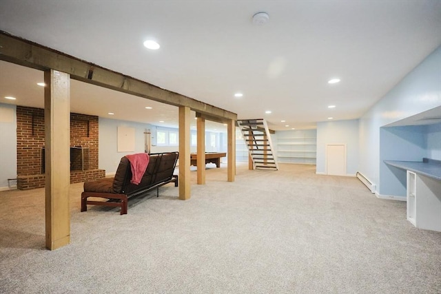 5 Taintor Dr, Sudbury, MA 01776 - basement with a baseboard heating unit, light colored carpet, recessed lighting, a fireplace, and stairway