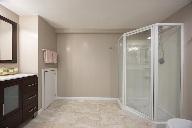 5 Taintor Dr, Sudbury, MA 01776 - bathroom featuring a stall shower, vanity, and baseboards