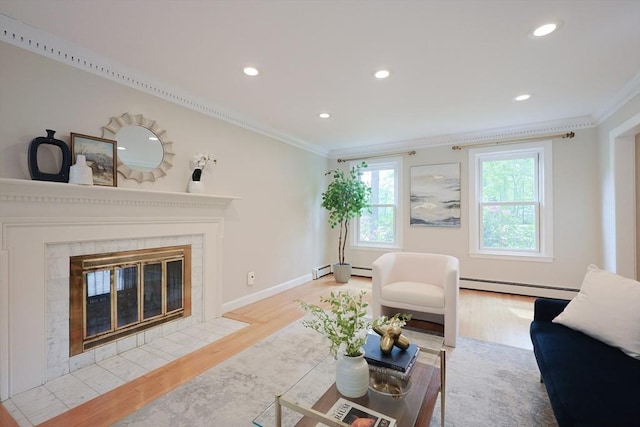 5 Taintor Dr, Sudbury, MA 01776 - living room featuring a baseboard radiator, ornamental molding, light wood-style floors, recessed lighting, and a tile fireplace