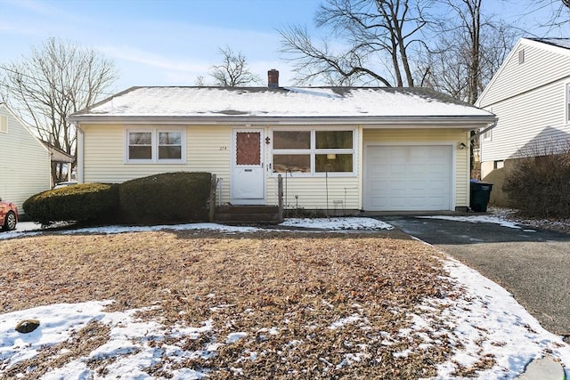 single story home featuring a garage