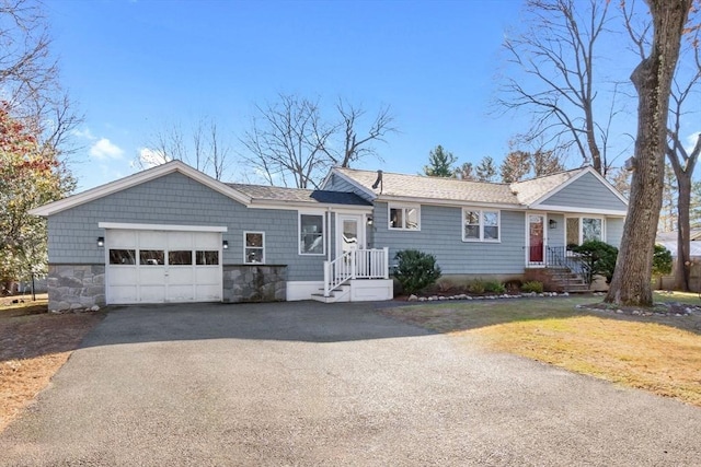 ranch-style house featuring a garage