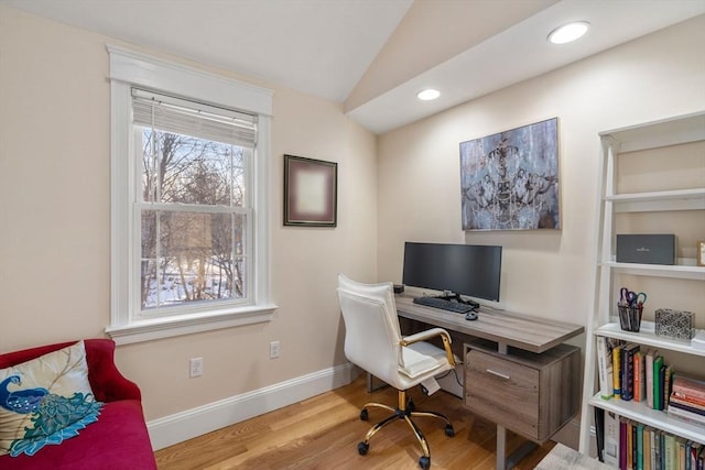 office space with hardwood / wood-style flooring and vaulted ceiling