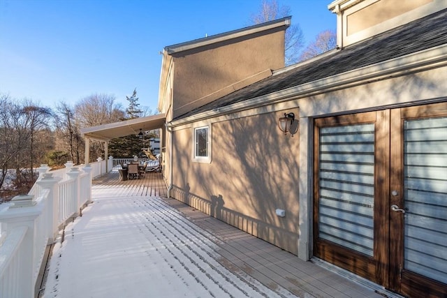 view of snow covered deck