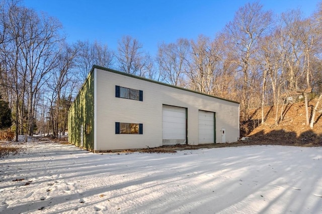 view of snow covered garage