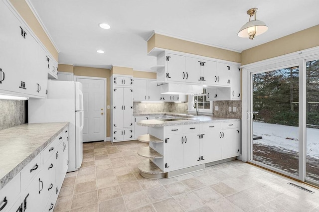 kitchen featuring visible vents, white cabinetry, open shelves, and light countertops