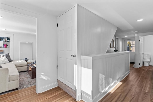 corridor featuring hardwood / wood-style floors