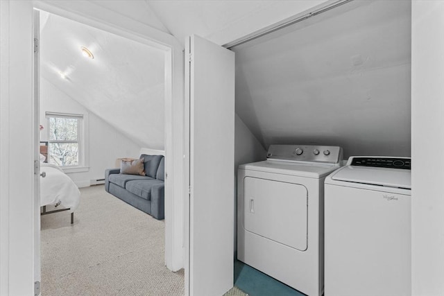 washroom featuring a baseboard heating unit and independent washer and dryer