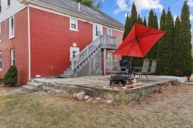 back of property with a patio