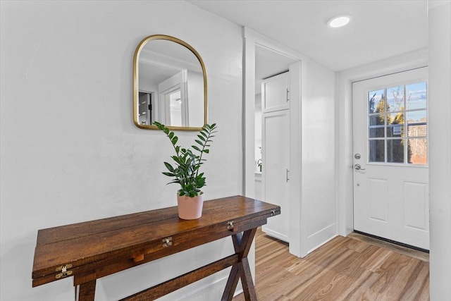 foyer with light hardwood / wood-style floors