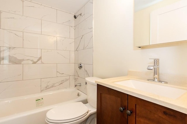 bathroom featuring toilet, vanity, and bathing tub / shower combination
