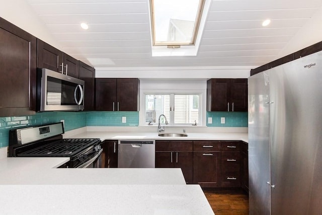 kitchen featuring light countertops, a sink, and appliances with stainless steel finishes