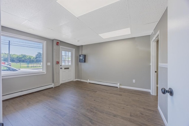 318 Newton St, South Hadley, MA 01075 - entryway with a baseboard radiator, wood finished floors, baseboards, and a paneled ceiling