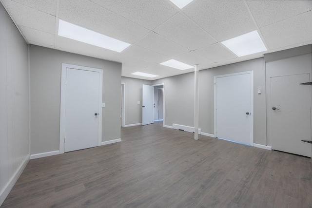 318 Newton St, South Hadley, MA 01075 - basement with a paneled ceiling, wood finished floors, and baseboards