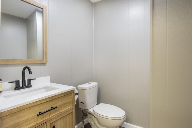 318 Newton St, South Hadley, MA 01075 - bathroom featuring vanity, toilet, and baseboards