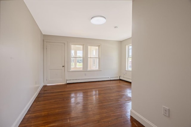 318 Newton St, South Hadley, MA 01075 - unfurnished room with a baseboard radiator, dark wood finished floors, and baseboards