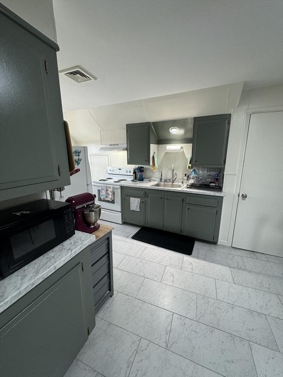 318 Newton St, South Hadley, MA 01075 - kitchen featuring white range with electric stovetop, light marble finish flooring, a sink, black microwave, and gray cabinetry