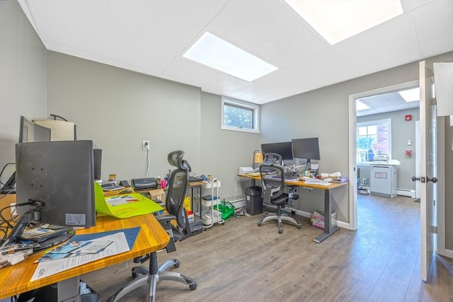 318 Newton St, South Hadley, MA 01075 - office space featuring wood finished floors, a baseboard heating unit, and baseboard heating