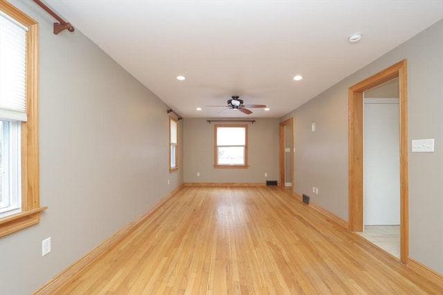 spare room featuring recessed lighting, light wood-style flooring, baseboards, and a ceiling fan