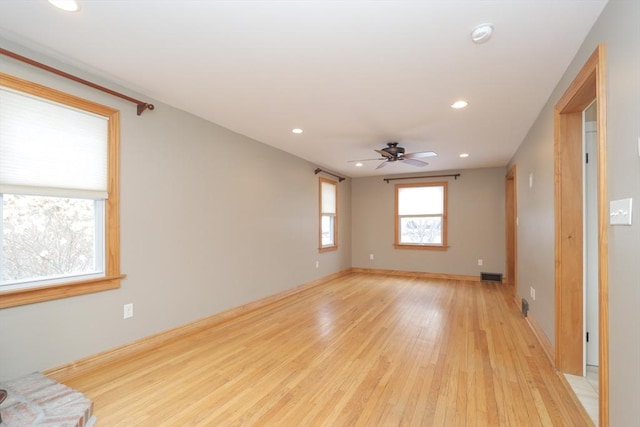 empty room featuring visible vents, baseboards, ceiling fan, recessed lighting, and light wood-style floors