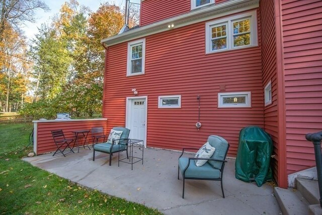 back of property with a patio area