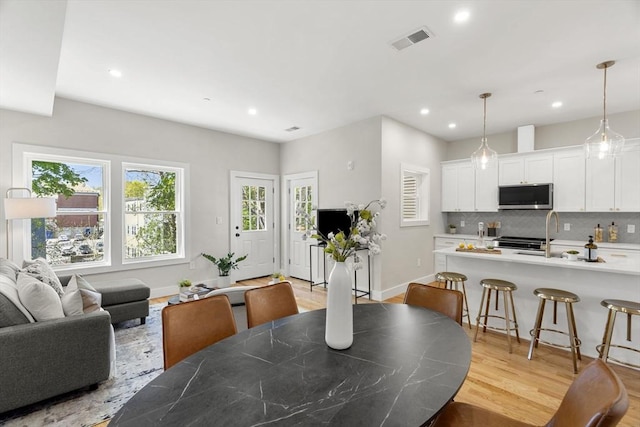 21 Ellington St Unit 3, Boston, MA 02121 - dining area with recessed lighting, light wood finished floors, and baseboards